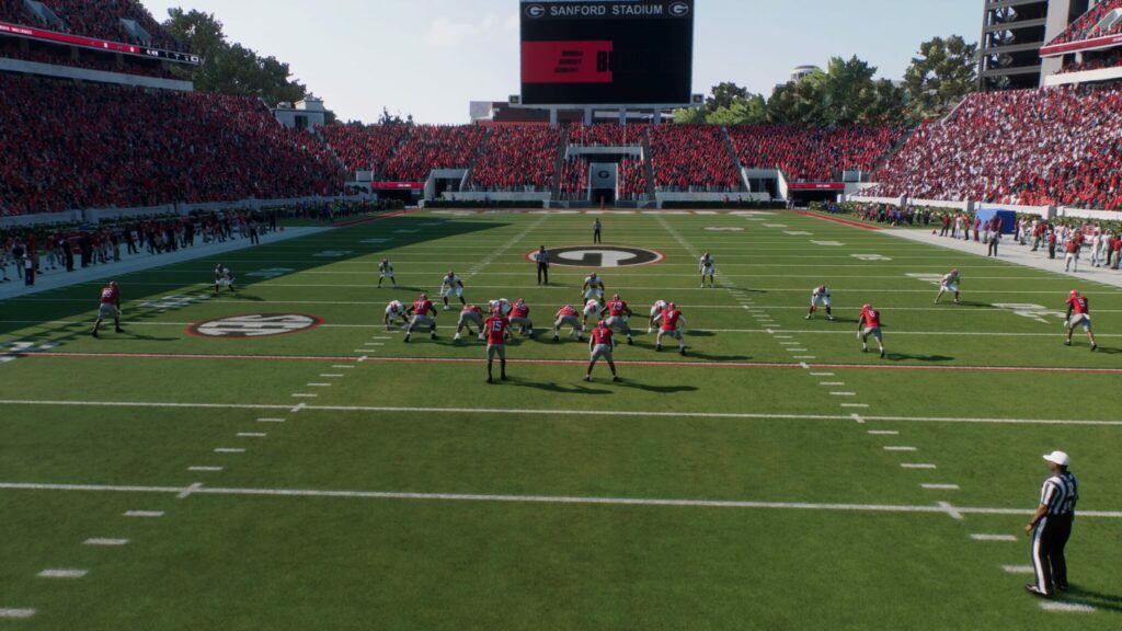 The offense and defense prepare for a play to start in College Football 25.