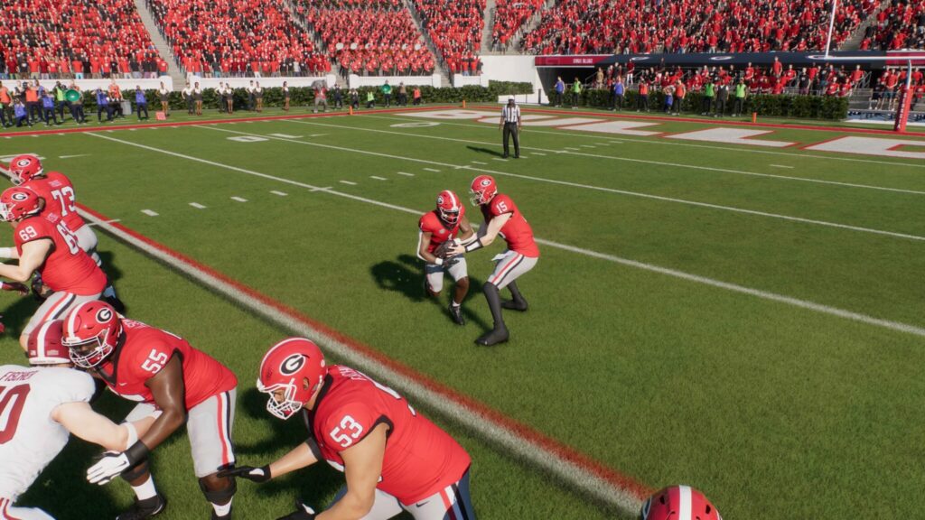 A quarterback hands the ball off in College Football 25.