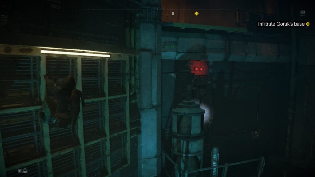 Kay Vess climbs along a grate.