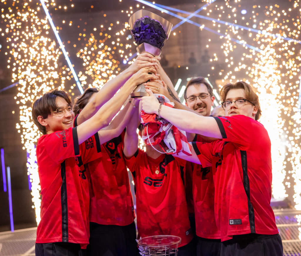 Sentinels celebrate onstage with trophy after victory at VALORANT Masters Madrid Grand Finals at the Madrid Arena on March 24, 2024 in Madrid, Spain. (Photo by Colin Young-Wolff/Riot Games)