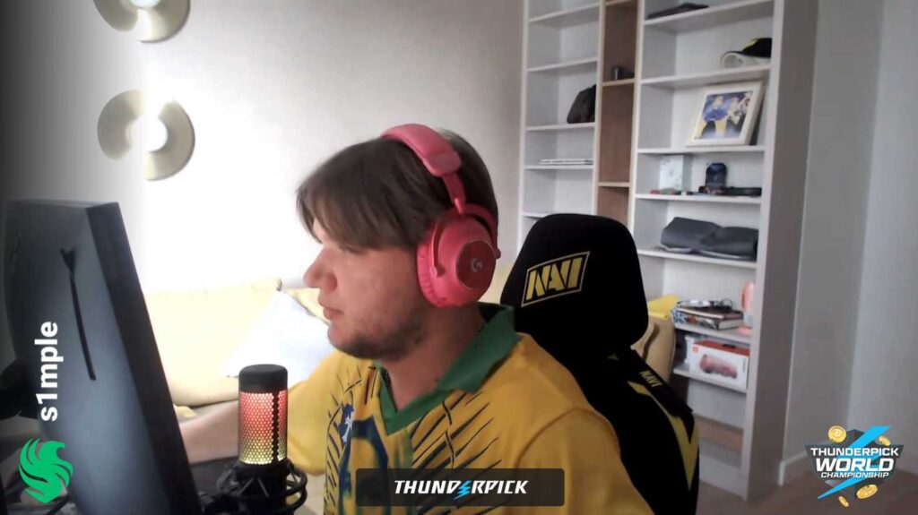 S1mple sits at his PC playing CS2 in a room.