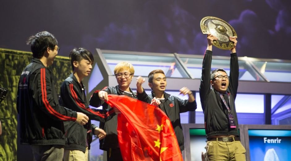 Newbee fly the Chinese flag at TI4 following their win.