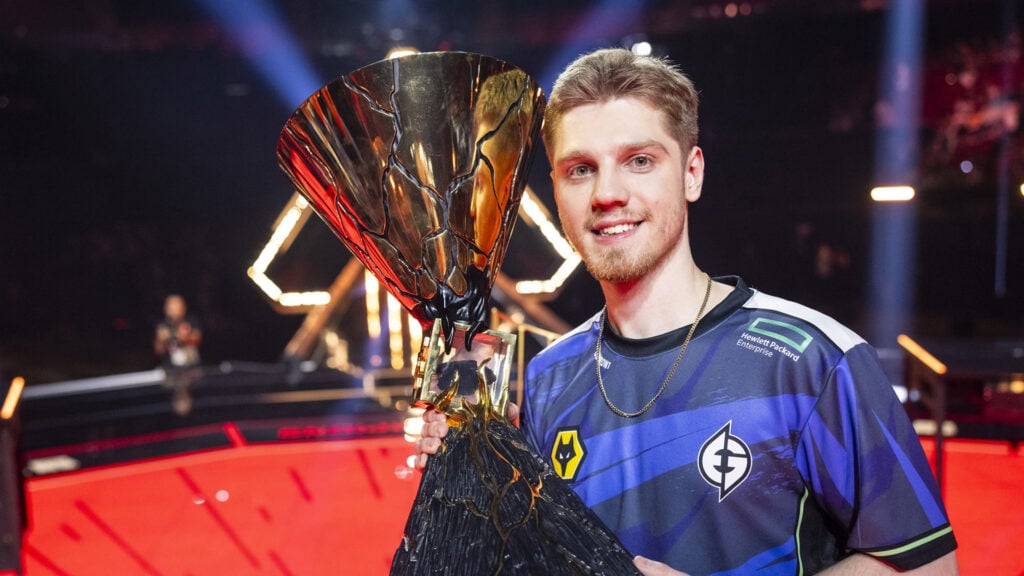 Demon1 poses with the VALORANT Champions trophy in 2023 after EG's win.