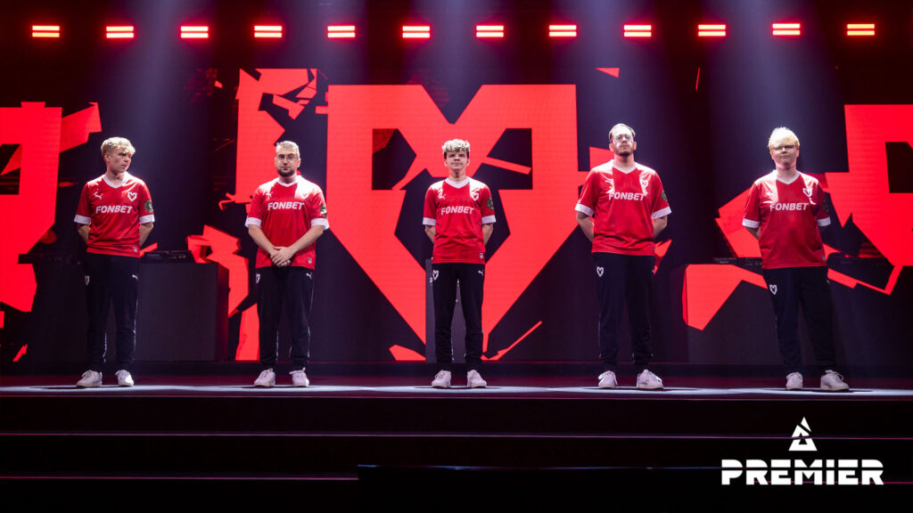 MOUZ CS2 stands on stage at a BLAST tournament.