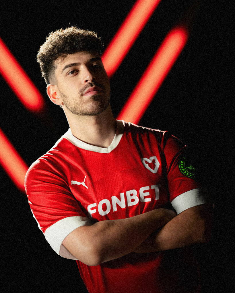 Spinx stands with his arms crossed representing MOUZ.