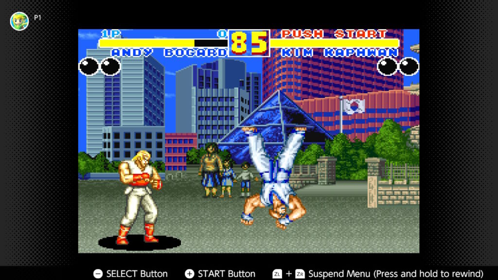 The image is a screenshot from a Fatal Fury 2 match: Andy Bogard vs Kim Kaphwan.