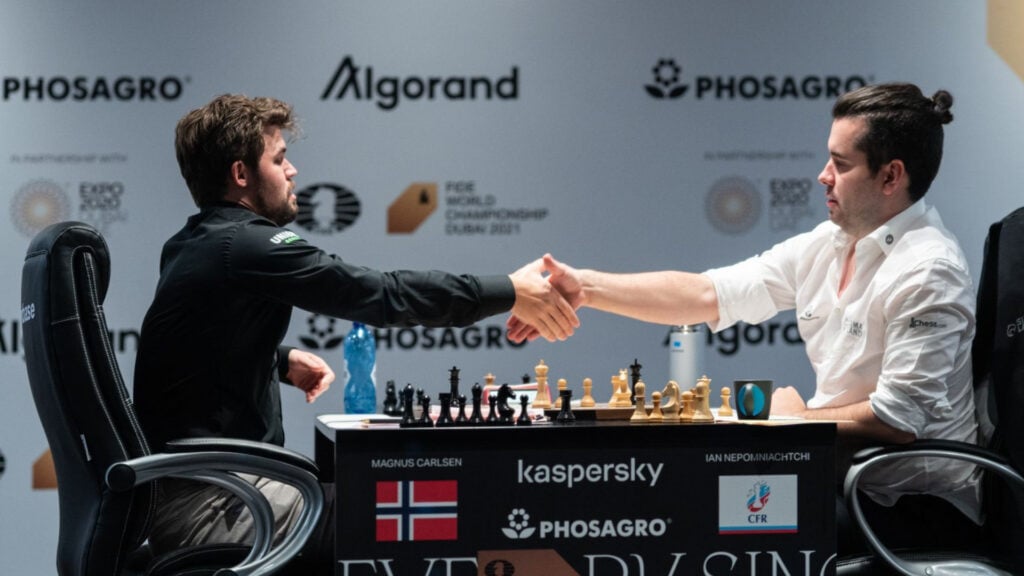 Photo of Carlsen accepting Nepomniachtchi's resignation of Game 6 of the 2021 World Championship