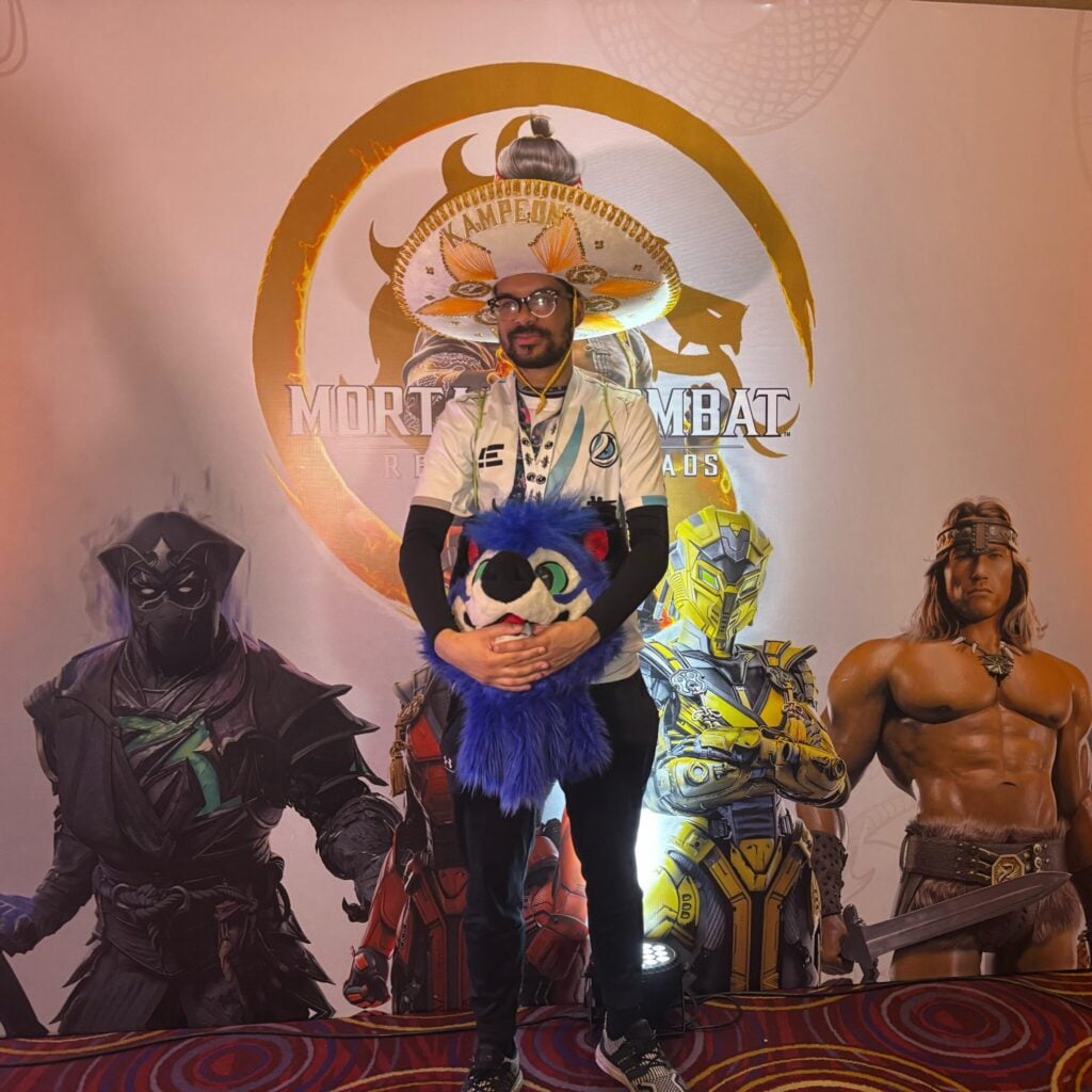 It’s a photo of the fighting games player SonicFox after their victory at the Mortal Kombat 1 esports event Pro Kompetition 2025 Mexico.