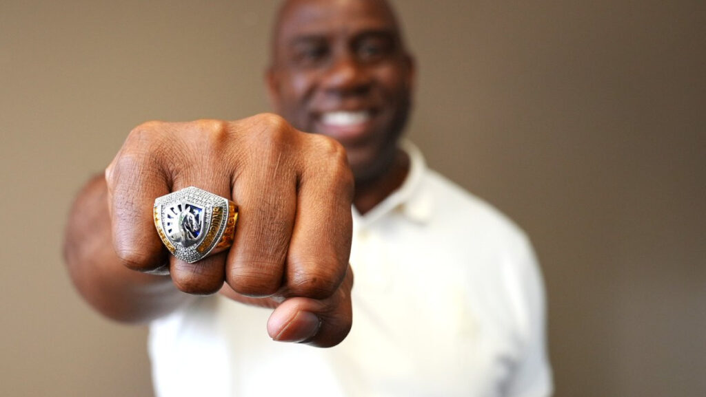Magic Johnson shows off his Team Liquid championship ring.