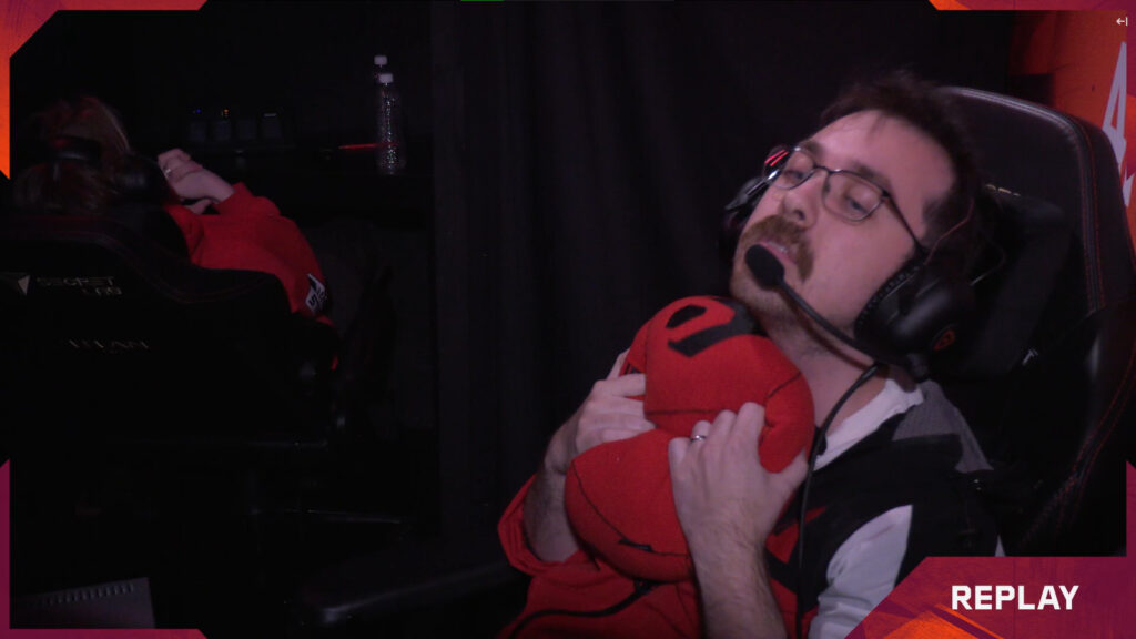 Sentinels coach kaplan squeezing Cubert during a replay.