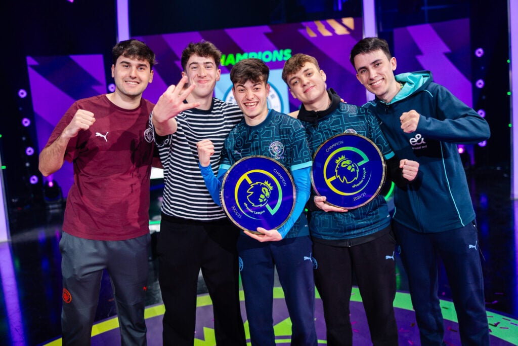 Man City's extended team celebrate their ePremier League win