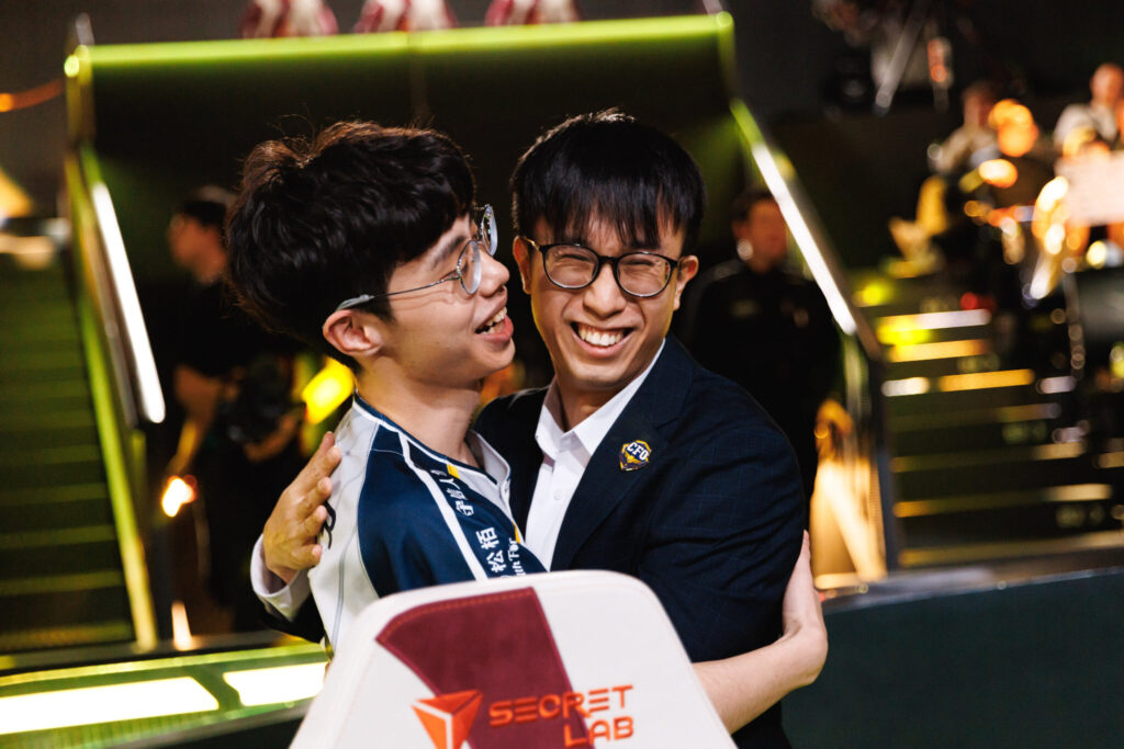 CFO player and coach embrace after an upset win at LoL First Stand 2025.