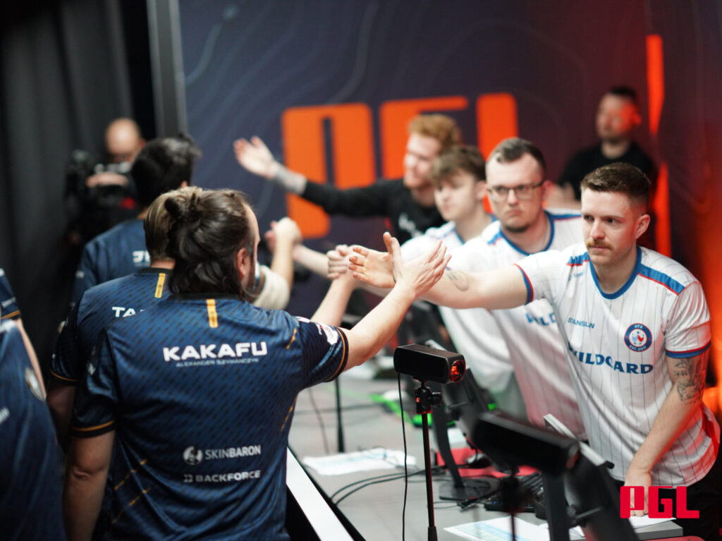 Wildcard, who plays Team Vitality, daps up a team at a PGL tournament.