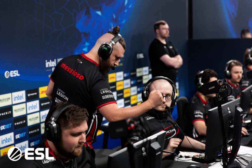 Manager and coach messioso fist bumps Grim after a round at IEM Melbourne.