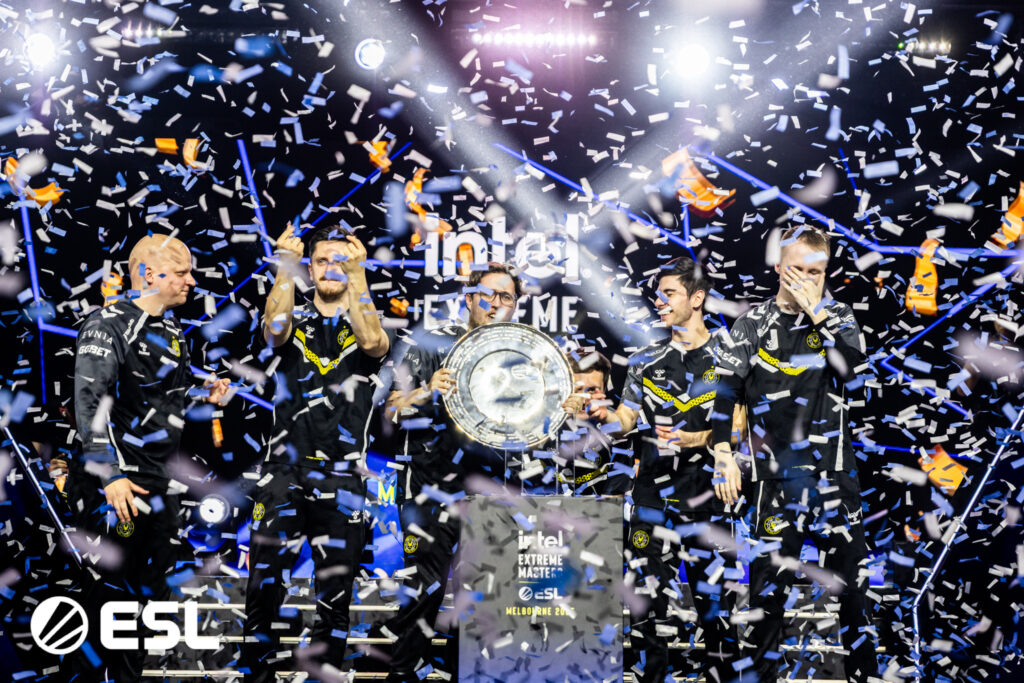 Vitality lifts the IEM Melbourne trophy as confetti falls.