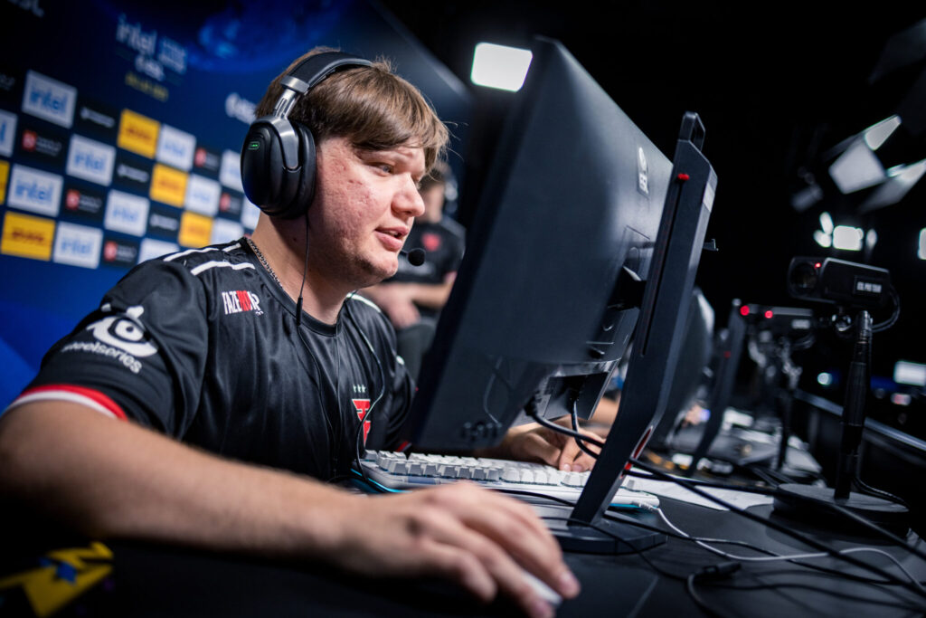 s1mple sits at a PC playing CS2 for FaZe at IEM Dallas 2025.