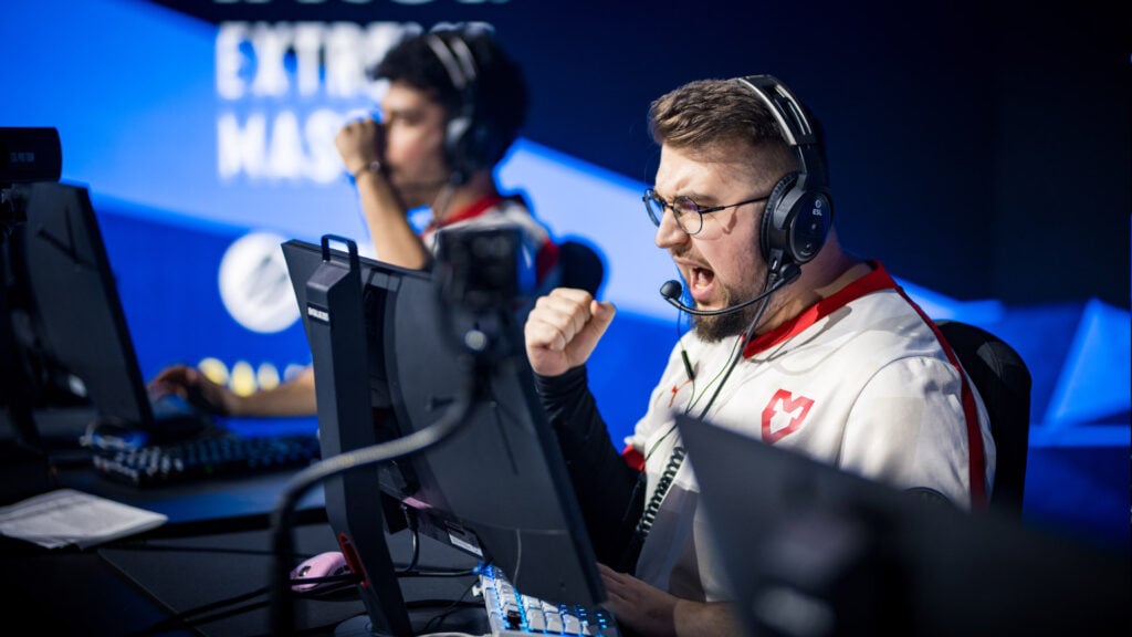 Torzsi celebrates while sitting at his PC playing CS2 at IEM Dallas 2025.
