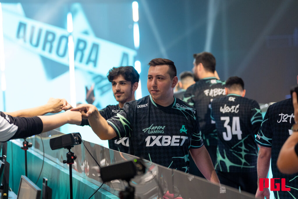 XANTARES fist bumps opponents at PGL Astana.