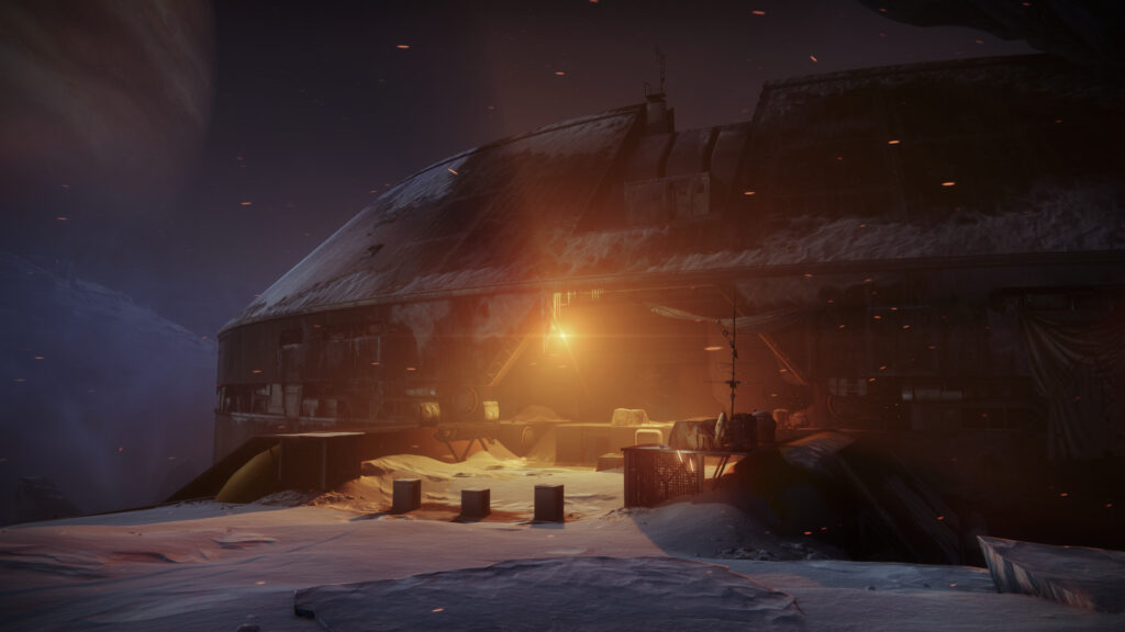 An orange light emits from an ancient Fallen base on Europe in Deep Stone Crypt, in Destiny 2.