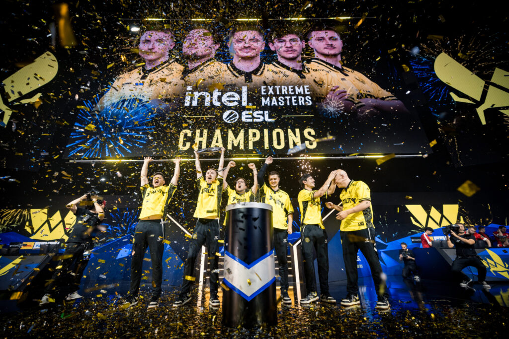 The photo features the CS2 esports team Vitality after their win at the tournament Intel Extreme Masters Dallas 2025