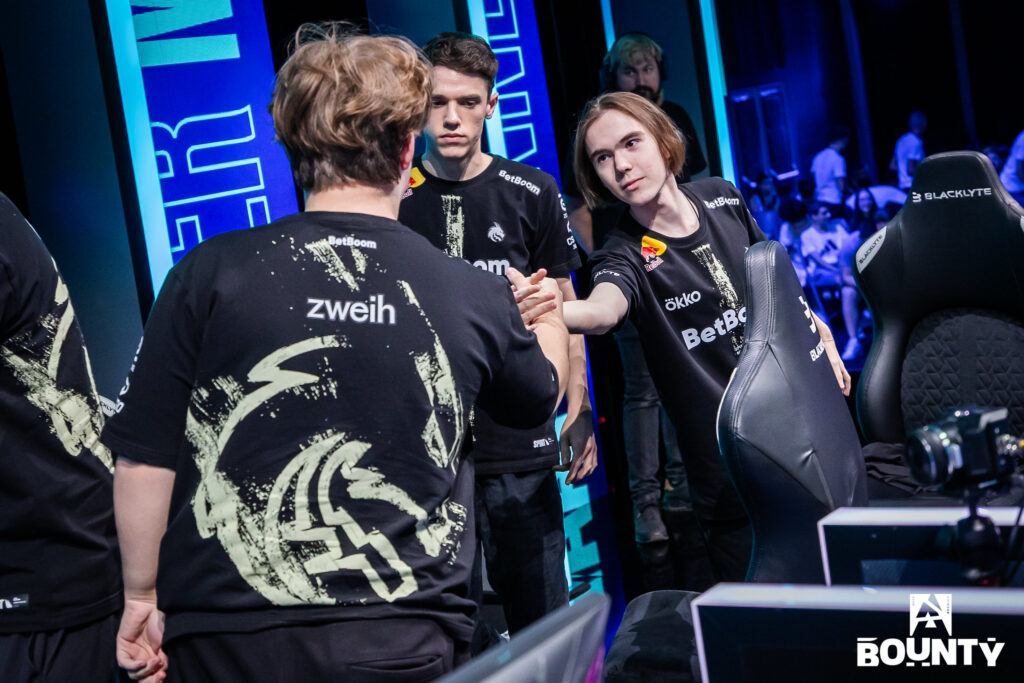 The photo features three CS2 players from Team Spirit: donk, zweih, and zont1x. They celebrate a match win at BLAST Bounty Fall 2025.