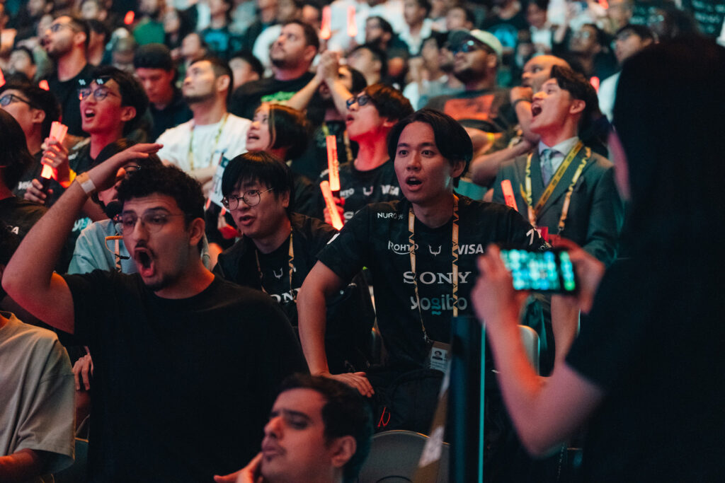 The photo features the legendary fighting games playesr Tokido and Fuudo at the Street Fighter 6 Esports World Cup 2025.