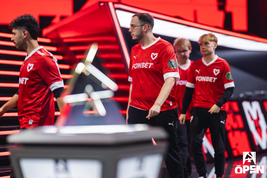 The photo features CS2 esports players from the team MOUZ during the tournament BLAST Open Fall 2025 Playoffs.