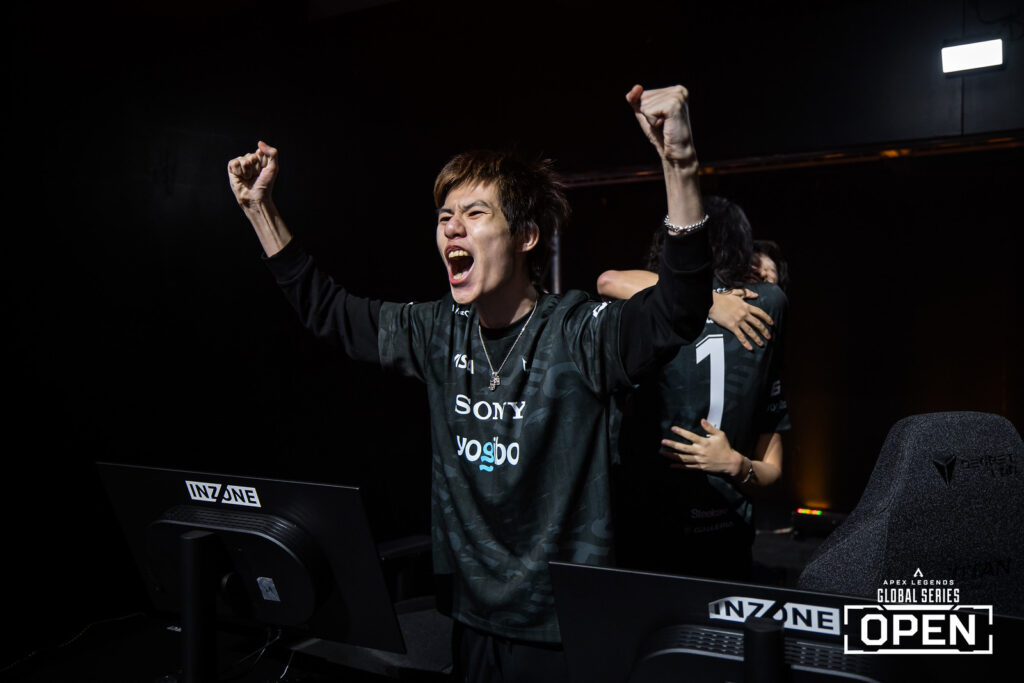 MiaK of REJECT celebrates on stage at APEX ALGS OPen