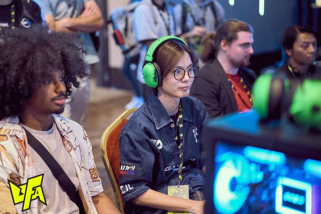It's a photo of the Street Fighter 6 esports player Sahara playing on the first tournament day at SF6 UFA 2025.