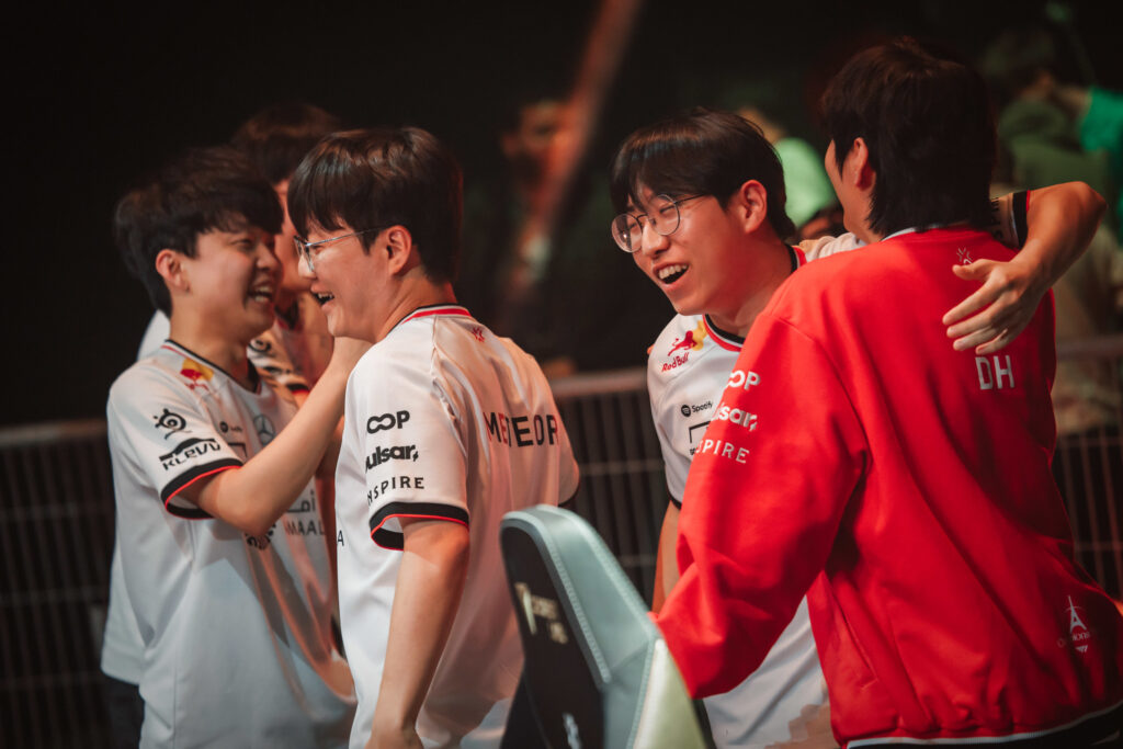 The VALORANT esports players from the team T1 celebrate a match win in the Group Stage of the tournament Champions 2025 in Paris — It’s a photo.