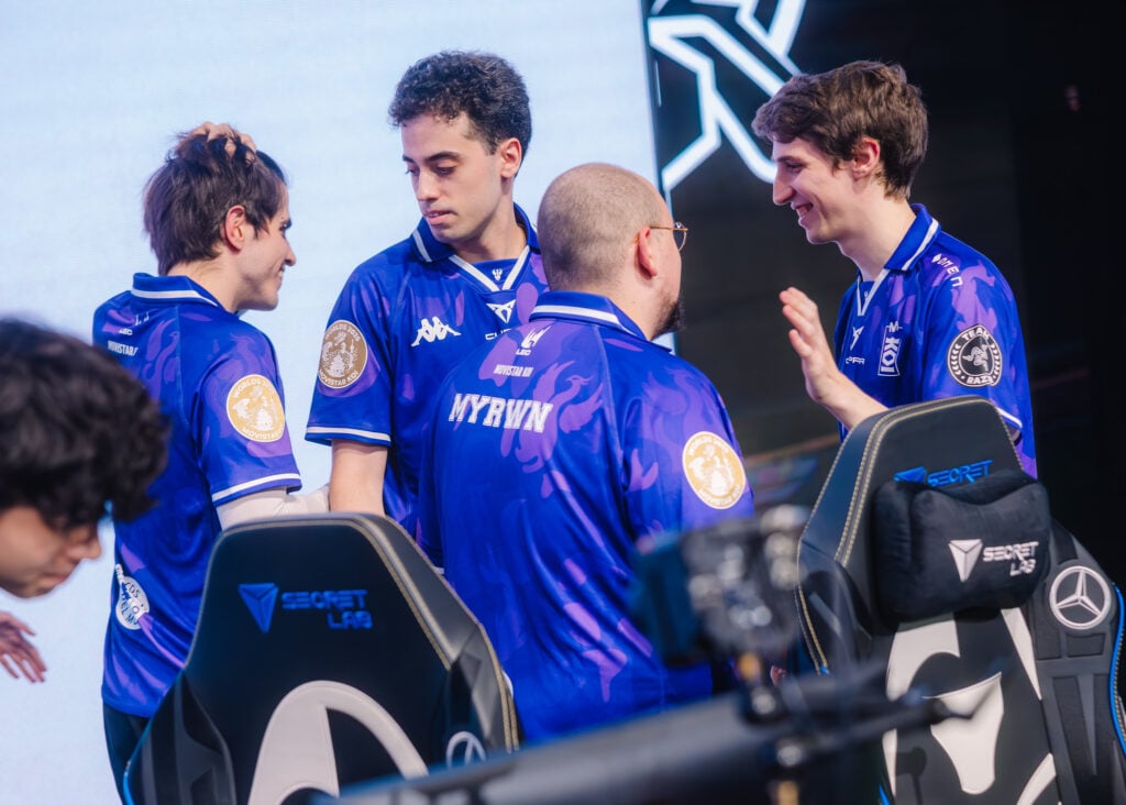 It’s a photo of the LoL Esports players from the team MKOI at the League of Legends World Championship 2025. They celebrate after a win over the team Secret Whales.
