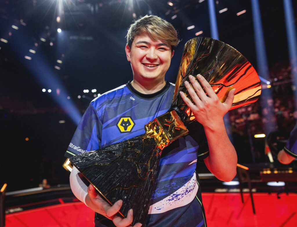 C0M with the Champions 2023 trophy (Photo via Colin Young-Wolff/Riot Games)