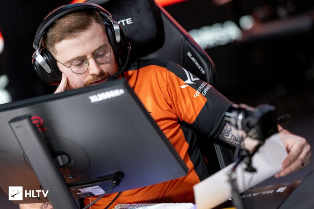 The photo features the CS2 coach and player daps from the team NRG.