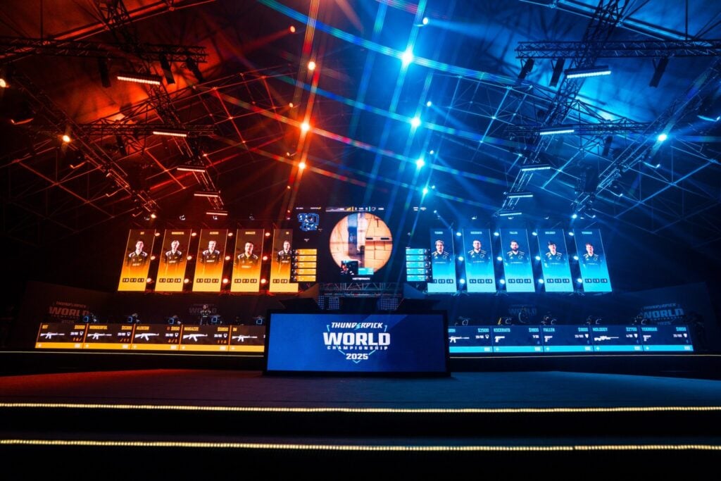 It’s a photo of the tournament stage during the CS2 Thunderpick World Championship 2025 — NAVI and FURIA are competing.