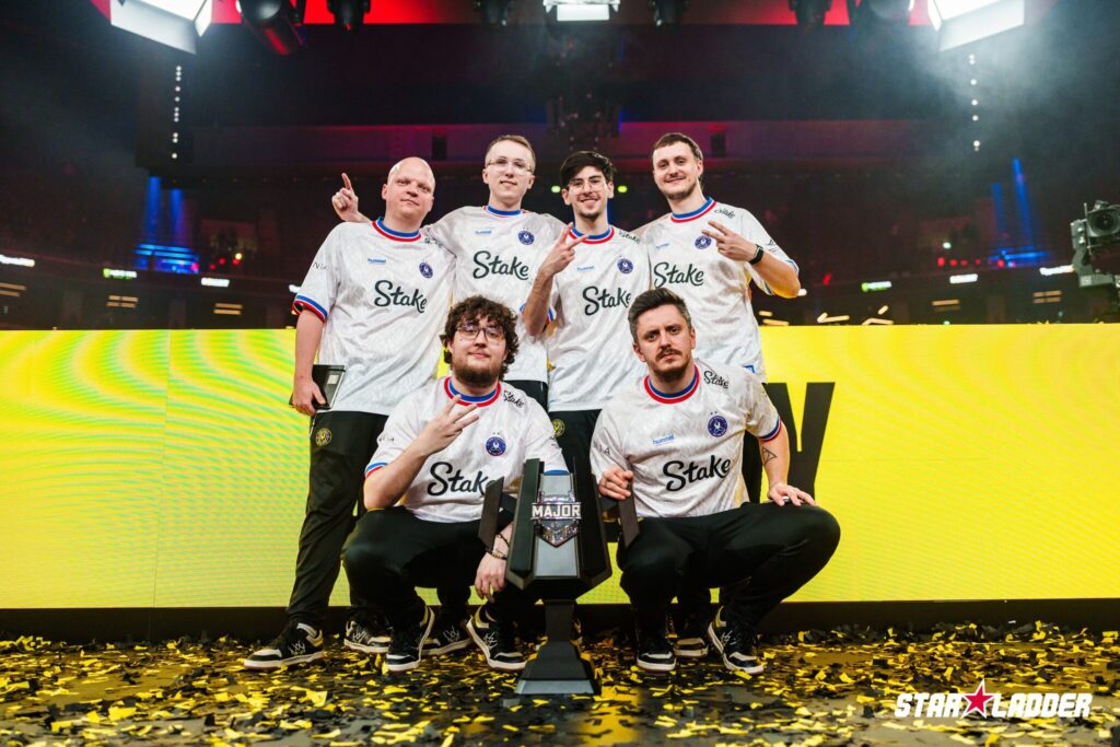 The Counter-Strike 2 players from Team Vitality with a trophy of the CS2 esports StarLadder Budapest Major 2025 - it’s a photo.
