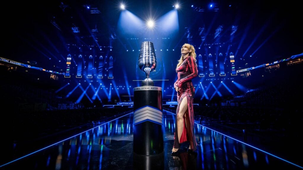 It’s a photo of the CS2 esports arena IEM Cologne 2025: the trophy and the host on the stage.