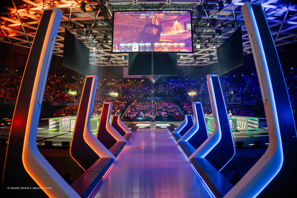 The photo from the Rainbow Six Siege X Munich Major 2025 features a view of the arena - a road for the teams to walk onto the stage.