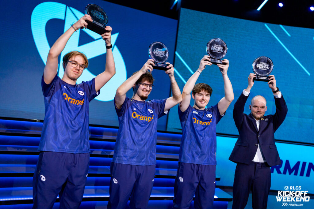 The photo of the Rocket League esports players from the team Karmine Corp - they hold the trophies after winning the Kick-Off Weekend 2025.