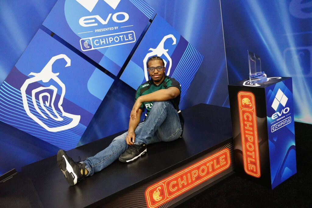 It’s a photo of the fighting games player Nitro during the event Evo 2025.