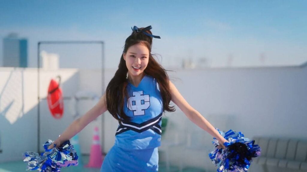 It’s a screenshot from the Korean reality show Single’s Inferno Season 5: the image shows one of the contestants, Park Hee-sun - dancing as a cheerleader.