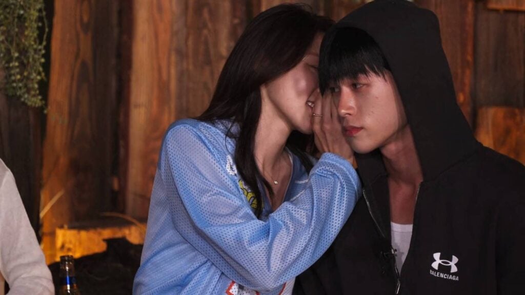 The screenshot from Netflix’s show Single’s Inferno Season 5: Choi Mina Sue and Song Seung-il near a campfire in episode 4.