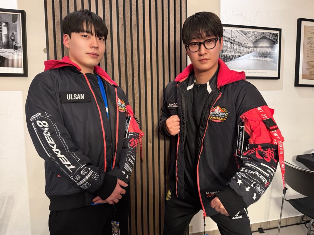 It’s a photo of the TEKKEN 8 esports players ULSAN and JEonDDing at the tournament TWT 2025 Finals.