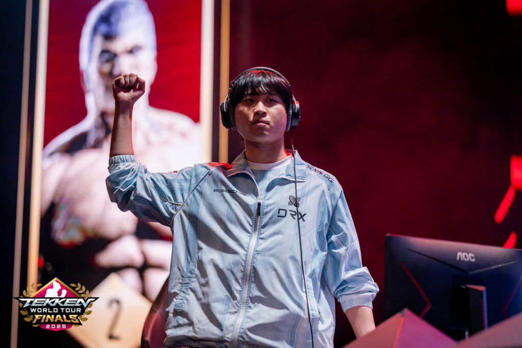 It’s a photo of the TEKKEN 8 esports player LowHigh after winning the TWT 2025 Finals.
