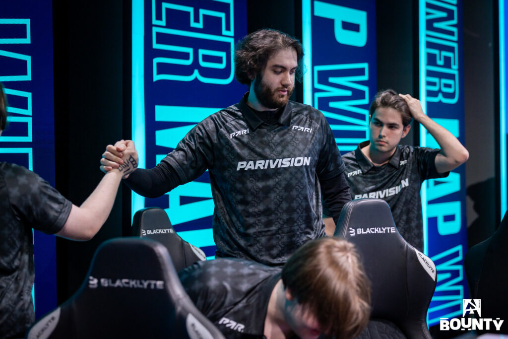 It’s a photo of the CS2 players from the team PARAVISION during the Counter-Strike tournament BLAST Bounty Winter 2026 — congratulate each other with a match win.