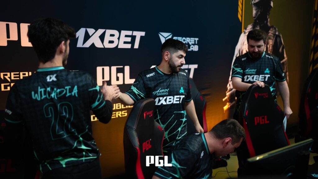 It’s a photo of Counter-Strike 2 players from the team Aurora Gaming during the Swiss Stage of the CS2 esports tournament PGL Cluj-Napoca 2026 — greet each other after a good match.