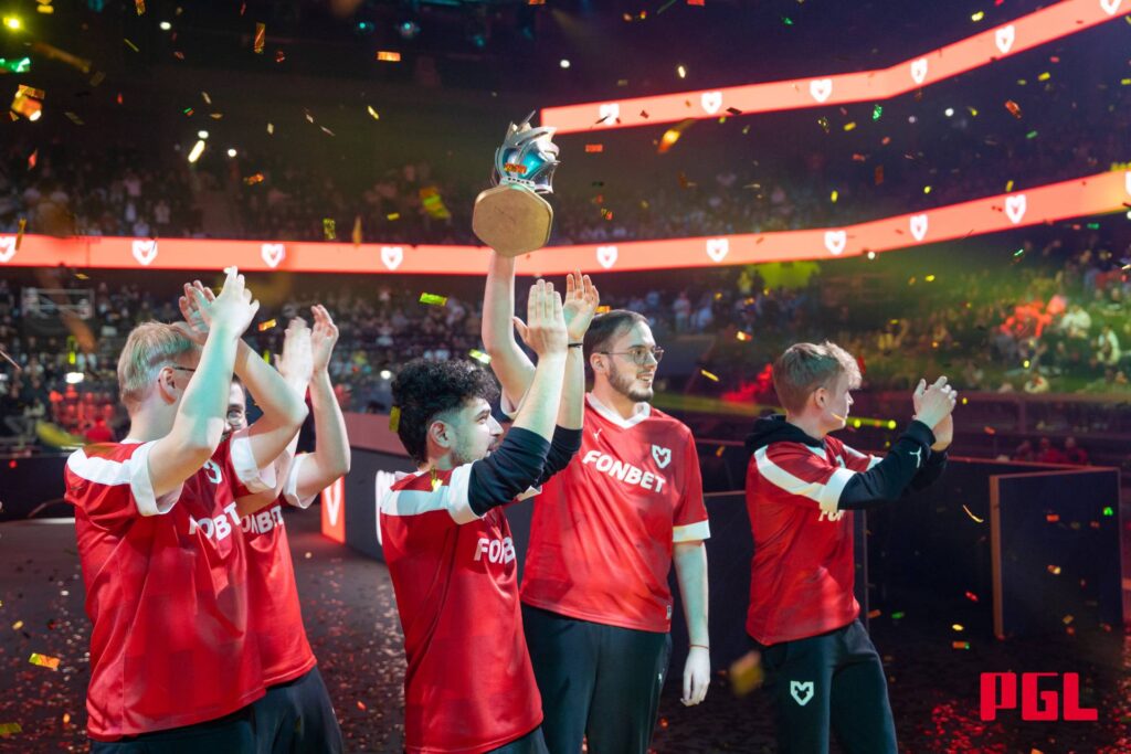 It’s a photo of the CS2 players from the team MOUZ with the trophy of the event PGL Cluj-Napoca 2025.