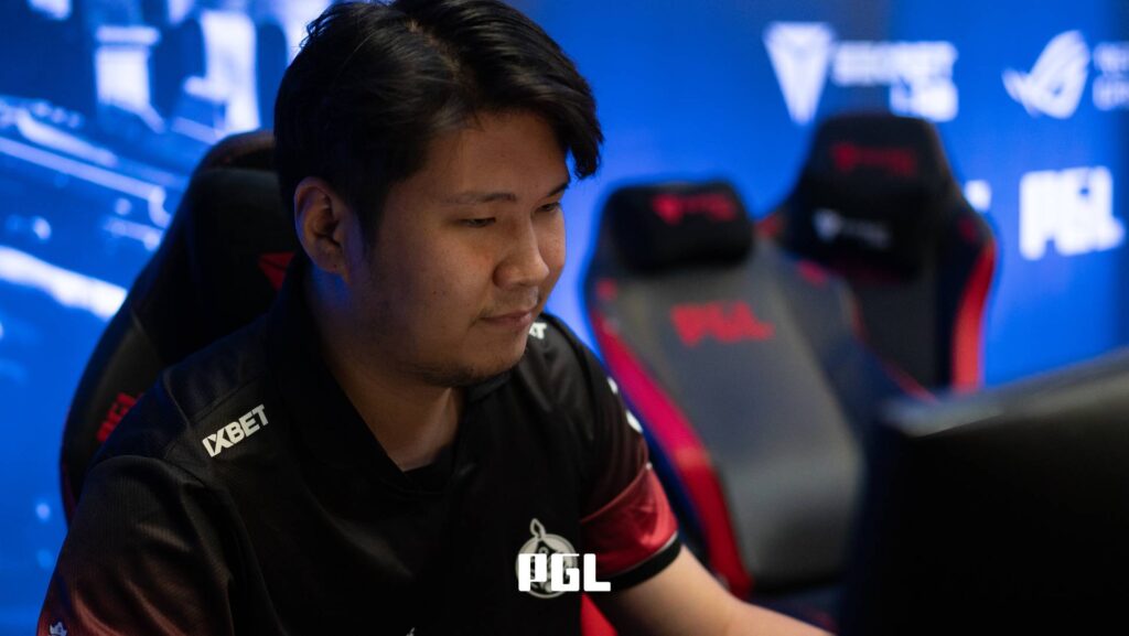 It’s a photo of the Counter-Strike 2 esports player Garidmagnai "bLitz" Byambasuren from the team The MongolZ on the opening day of the CS2 tournament PGL Cluj-Napoca 2026 — focused in front of a computer.