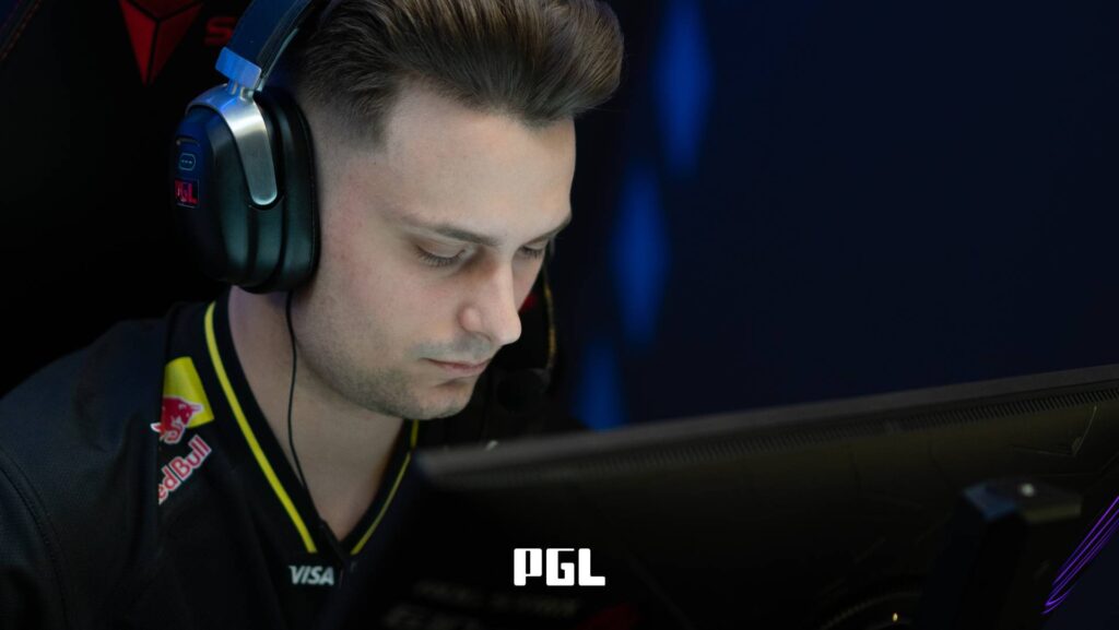 It’s a photo of Counter-Strike 2 player Mihai "iM" Ivan from the team NAVI during the Swiss Stage of the CS2 esports tournament PGL Cluj-Napoca 2026 — in front of a monitor, focused during a match.