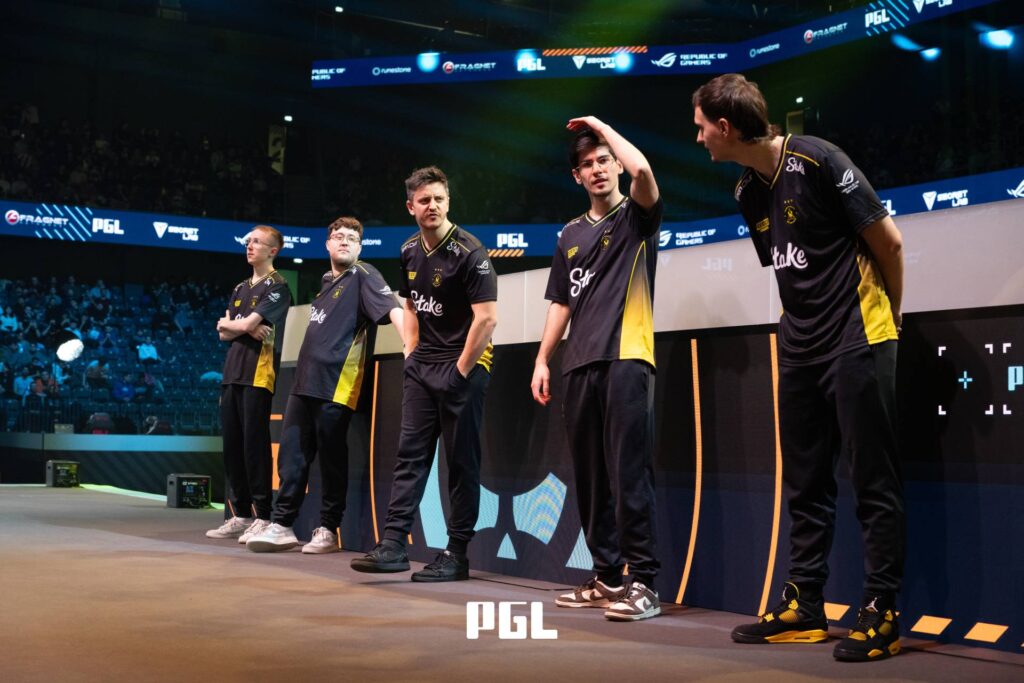 It’s a photo of Counter-Strike 2 players from Team Vitality during the Playoffs at the CS2 esports tournament PGL Cluj-Napoca 2026 — standing on the stage before the semifinal versus The MongolZ.
