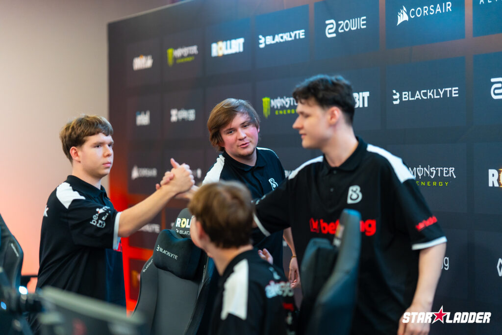 It’s a photo of the CS2 players from the team B8 during the esports tournament Budapest Major 2025: greet each other after a match.